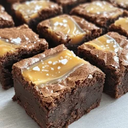 - 1 cup unsalted butter (2 sticks) - 1 1/4 cups granulated sugar - 1 cup brown sugar, packed - 4 large eggs - 1 teaspoon vanilla extract - 1 cup all-purpose flour - 1/2 cup unsweetened cocoa powder - 1/2 teaspoon salt - 1 cup semi-sweet chocolate chips - 1/2 cup store-bought or homemade salted caramel sauce - Flaky sea salt, for topping Quality chocolate chips are essential for rich flavors. I prefer semi-sweet chips for balance. If you choose to make your own caramel, it can taste fresher. Store-bought caramel saves time but may lack depth. For a vegan option, use vegan butter. It works well in this recipe. You can also try gluten-free flour. Look for a blend that can substitute one-to-one for all-purpose flour. This way, everyone can enjoy these brownie bites! - Preheat your oven to 350°F (175°C). - Line a 9x9 inch baking pan with parchment paper. - Let some parchment hang over the sides for easy removal. - In a medium saucepan, melt 1 cup of unsalted butter over low heat. - After melting, stir in 1 1/4 cups of granulated sugar and 1 cup of brown sugar until smooth. - Let the mixture cool slightly. - Whisk in 4 large eggs one at a time. - Add 1 teaspoon of vanilla extract and mix well. - In a separate bowl, sift together 1 cup of all-purpose flour, 1/2 cup of cocoa powder, and 1/2 teaspoon of salt. - Gradually fold the dry mix into the wet mix with a spatula until just combined. - Gently fold in 1 cup of semi-sweet chocolate chips. - Spread half of the brownie batter in the pan evenly. - Drizzle half of the salted caramel sauce on top. - Add the remaining brownie batter over the caramel. - Place dots of the leftover salted caramel on top. - Swirl gently with a knife for a marbled effect. - Bake for 25-30 minutes. - Check if a toothpick comes out with a few moist crumbs. - After baking, remove the pan and let the brownies cool for about 10 minutes. - Lift the brownies out using the parchment overhang. - Let them cool completely on a wire rack. - Just before serving, sprinkle flaky sea salt over the brownies for a tasty finish. For the full recipe, refer to the section above. To get the perfect texture for your brownie bites, keep these tips in mind: - Use room temperature ingredients. This helps achieve a smooth batter. - Melt butter gently. Too much heat can change the butter's structure. - Mix just enough. Combine until you see no dry flour. Overmixing leads to tough brownies. These brownie bites pair well with many drinks. Here are some ideas: - Coffee or espresso. The bitterness complements the sweetness. - Milk or milk alternatives. A classic pairing that balances the rich flavors. - Ice cream. A scoop on top makes for a delightful dessert. To present them nicely at gatherings: - Serve on a tiered cake stand. This adds height and style. - Garnish with fresh berries. They add color and freshness to the plate. Avoid these common pitfalls for the best results: - Overbaking can dry out flavors. Keep an eye on the time. Check with a toothpick. It should have some moist crumbs. - Don’t rush the cooling time. Allow the brownies to cool fully. Cutting them too soon can lead to a mess. For a complete guide, check out the Full Recipe. {{image_2}} You can change up the flavor of salted caramel brownie bites in fun ways. Adding nuts gives a nice crunch. Try walnuts or pecans for a rich taste. For a twist, mix in chocolate chips. You can use dark or white chocolate for extra flavor. Seasonal add-ins are also fun! In winter, add peppermint extract for a minty taste. In spring, a bit of orange zest can brighten your bites. If you need gluten-free options, swap regular flour for gluten-free flour. This makes a great treat for everyone. For nut-free bites, skip the nuts entirely. You can also use applesauce instead of eggs for a vegan option. Want a healthier choice? Use less sugar or swap in a sugar alternative. You can even add pureed beans for a protein boost without changing the taste. If you want to try something different, make salted caramel brownie cupcakes. Just pour the batter into cupcake liners and bake for about 20 minutes. You can also create a layered salted caramel brownie cake. Use two batches of the brownie mix and layer them with salted caramel in between. This makes a stunning dessert for any event. For all the details, check the Full Recipe. To keep your salted caramel brownie bites fresh, use an airtight container. This helps stop air and moisture from ruining their taste. Store them at room temperature for up to three days. If you want them to last longer, put them in the fridge. Just remember, cold can change the texture a bit. To freeze brownie bites, wrap each one in plastic wrap. Then, place them in a freezer bag. This keeps them safe from freezer burn. For best taste, eat them within three months. When you’re ready to eat, take them out and let them thaw at room temperature. You can also warm them in the microwave for a few seconds for a soft bite. Salted caramel brownie bites stay fresh for about a week at room temperature. In the fridge, they can last up to two weeks. To maintain that yummy flavor, keep them sealed tight. If they start to dry out, you might lose some of that rich taste. Following these tips will help you enjoy your treats longer. For the full recipe, check the earlier section! You can check if your brownie bites are done by inserting a toothpick into the center. If it comes out with a few moist crumbs, they are ready. If it’s wet with batter, they need more time. Brownies can firm up as they cool, so don’t worry if they feel soft right out of the oven. Yes, you can make these brownies without eggs. Substitute each egg with a mix of 1 tablespoon of ground flaxseed and 2.5 tablespoons of water. Let it sit for about five minutes until it gets thick. You can also use unsweetened applesauce or mashed bananas as a binder. These brownie bites go well with ice cream, whipped cream, or a drizzle of extra caramel sauce. A scoop of vanilla ice cream adds a nice creamy texture. You can also pair them with a rich cup of coffee or a glass of milk. To make caramel sauce from scratch, heat 1 cup of sugar in a saucepan over medium heat. Stir until it melts and turns golden brown. Remove from heat and carefully add 1/2 cup of heavy cream and 1/4 cup of butter. Stir until smooth. Add a pinch of salt for that salted caramel flavor. Yes, you can make these brownie bites ahead of time. Once baked and cooled, store them in an airtight container. They will stay fresh for about three days at room temperature. You can also freeze them for up to three months. Absolutely! You can double the recipe. Just be sure to use a larger pan, like a 9x13-inch one. Keep an eye on the baking time. They might need a few extra minutes in the oven. Check for doneness with a toothpick as mentioned earlier. If you want the full recipe, check out the Full Recipe section! A complete recipe guide to make Salted Caramel Brownie Bites. These brownie bites mix sweet chocolate and rich caramel. You will love how easy they are to make! - 1 cup unsalted butter (2 sticks) - 1 1/4 cups granulated sugar - 1 cup brown sugar, packed - 4 large eggs - 1 teaspoon vanilla extract - 1 cup all-purpose flour - 1/2 cup unsweetened cocoa powder - 1/2 teaspoon salt - 1 cup semi-sweet chocolate chips - 1/2 cup store-bought or homemade salted caramel sauce - Flaky sea salt, for topping 1. Preheat your oven to 350°F (175°C). Line a 9x9 inch baking pan with parchment paper. Leave some overhang for easy removal. 2. In a medium saucepan, melt the butter over low heat. Remove from heat and mix in granulated sugar and brown sugar until smooth. 3. Let the mixture cool a bit. Whisk in the eggs, one at a time. Add in the vanilla extract and mix well. 4. In another bowl, sift the flour, cocoa powder, and salt together. Fold the dry mix into the wet mix with a spatula until just combined. 5. Gently fold in the chocolate chips. Make sure they spread evenly throughout the brownie batter. 6. Spread half of the brownie batter into the prepared pan. Drizzle half of the salted caramel sauce over it. Add the rest of the brownie batter on top. 7. Place dots of the remaining salted caramel sauce on the top layer. Swirl it gently with a knife for a marbled look. 8. Bake in the preheated oven for 25-30 minutes. A toothpick inserted in the center should come out with a few moist crumbs. 9. Take the brownies out of the oven. Let them cool in the pan for about 10 minutes. Use the parchment overhang to lift them out. 10. Let the brownies cool completely on a wire rack before cutting them into bite-sized squares. 11. Before serving, sprinkle flaky sea salt over the top for an extra burst of flavor. Prep Time: 15 minutes | Total Time: 45 minutes | Servings: 24 bites In this blog post, I shared the key ingredients and steps to make delicious salted caramel brownie bites. We discussed the importance of quality ingredients and provided helpful tips and tricks for baking. You learned about variations and how to properly store your treats to maintain freshness. These brownie bites are an easy, enjoyable dessert for any occasion. With a few tweaks, you can make them just right for your taste. Happy baking!