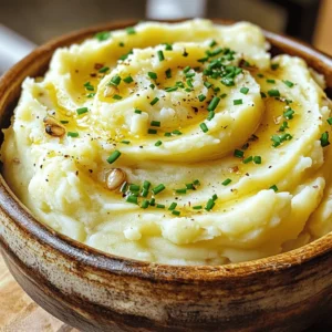 - 2 pounds Yukon Gold potatoes - 1 head of garlic - 1/2 cup heavy cream - 1/2 cup unsalted butter - Salt and pepper to taste - Fresh chives for garnish - Optional: 1/4 cup cream cheese What can I use instead of Yukon Gold potatoes? You can use Russet potatoes or red potatoes. Russets give a fluffier texture, while reds add a bit of creaminess. What are some dairy-free options? Try using almond milk or coconut milk. For a buttery flavor, use vegan butter. Can I change the herbs? Yes! Use rosemary or thyme for a different taste. You can also add some parsley for freshness. Roasted garlic mashed potatoes are not just a side dish; they are a warm hug on a plate. The rich flavors and creamy texture will make you go back for seconds. For the full recipe, check out the details above. To make roasted garlic, you first need to cut the top off a head of garlic. This exposes the cloves. Drizzle a little olive oil on top and wrap it in foil. Place it in a preheated oven at 400°F (200°C). Roast for about 30-35 minutes. You know it's ready when the garlic is soft and smells amazing. While the garlic roasts, fill a large pot with salted water and bring it to a boil. Add 2 pounds of peeled and cubed Yukon Gold potatoes. Cook them for about 15-20 minutes. Check for doneness by poking a potato with a fork. It should be fork-tender and easy to mash. Once the garlic is cool, squeeze the soft cloves into the pot with the potatoes. In a separate small saucepan, heat 1/2 cup of heavy cream and 1/2 cup of unsalted butter until warm. Pour this mixture over the potatoes and garlic. Add salt and pepper to taste. Use a potato masher to combine everything. Mash until smooth and creamy. If you want it creamier, add more cream or even 1/4 cup of cream cheese. Taste and adjust seasoning if needed. Transfer to a bowl and garnish with chopped fresh chives. Enjoy your Roasted Garlic Mashed Potatoes! For the full recipe, refer to the detailed instructions above. To get the best creamy mashed potatoes, start with warm ingredients. Cold cream or butter will cool down your potatoes. This can make them less creamy. So, heat your cream and butter before adding them. It helps create that smooth texture you want. Using the right tools also makes a huge difference. A potato masher or a ricer gives you the best results. Avoid using a food processor. It can make your potatoes gummy. I like to mash by hand for great control. You can boost the flavor of your mashed potatoes with herbs and spices. Fresh chives and garlic add a nice touch. You can also try rosemary or thyme for something different. Just remember to chop them finely to mix well. Adding cheese is another tasty option. Cream cheese makes your mashed potatoes extra creamy. Parmesan or cheddar can add a savory flavor too. Just mix it in when you combine the other ingredients. Roasted garlic mashed potatoes pair well with many dishes. They go great with roasted meats like chicken or beef. You can also serve them with grilled vegetables for a lighter meal. For presentation, use a large serving bowl. Scoop the potatoes in and make a nice swirl on top. Then, sprinkle some fresh chives for color. You can even drizzle a bit of olive oil for shine. For the full recipe, check the detailed instructions above. {{image_2}} You can use many types of potatoes for your mashed dish. Yukon Gold potatoes are great for their creamy texture. Russet potatoes offer a fluffy finish. For a mix, try combining the two. This blend gives you the best of both worlds. Each type adds its unique flavor and texture to your dish. Get creative with flavors by adding roasted vegetables. Think of carrots, bell peppers, or even mushrooms. These can add a nice touch and extra taste. You can also infuse your mashed potatoes with truffle oil. Just a little goes a long way. It gives your dish a rich, earthy flavor that many love. If you're looking for vegan options, substitute butter with olive oil or vegan butter. Use almond or coconut milk instead of cream. This keeps your dish rich but plant-based. For low-carb alternatives, consider using cauliflower. It mashes well and has a similar texture. You can find more details in the Full Recipe for Roasted Garlic Mashed Potatoes. After making roasted garlic mashed potatoes, let them cool. Place leftovers in an airtight container. This keeps them fresh and safe to eat. Store them in the fridge for up to four days. When you're ready to enjoy them again, reheat in a pot on low heat. Stir often to avoid scorching. You can also use a microwave. Heat in short bursts, stirring in between, until warm. To freeze roasted garlic mashed potatoes, start by cooling them completely. Use a spoon to pack them into a freezer-safe container. Leave some space at the top for expansion. Seal them tightly and label with the date. They can last for about two months in the freezer. When you're ready to eat them, thaw overnight in the fridge. To reheat, place them in a pot with a splash of milk. Heat on low, stirring gently until creamy. You might need to add more milk to get the right texture. In the fridge, roasted garlic mashed potatoes can last about four days. If you freeze them, they stay good for about two months. Always check for any off smells or changes in texture before eating. If they seem off, it's best to toss them. Keeping track of how long they’ve been stored helps you enjoy them at their best. The best potato for mashed potatoes is the Yukon Gold. This potato has a creamy texture and a buttery flavor. They mash well and become smooth and fluffy. I recommend using Yukon Gold for the best results. You can use pre-made garlic, but fresh is best. Roasting fresh garlic brings out its sweet, nutty flavor. Pre-made garlic lacks that depth. If you must use it, adjust the amount to your taste. To make your mashed potatoes fluffier, use warm ingredients. Heat your cream and butter before mixing. Also, mash the potatoes gently. Over-mashing can lead to gummy potatoes. A potato ricer can help achieve a light texture. Yes, you can make mashed potatoes ahead of time. Prepare them and keep them warm in a slow cooker. Stir them occasionally and add a bit more cream if needed. They can also be stored in the fridge and reheated later. If your mashed potatoes are gummy, don't worry. Add a bit of warm cream or milk while mixing. Stir gently to loosen them up. If they are too sticky, you can fold in some extra butter to help improve the texture. For a full recipe, check out the [Full Recipe]. In this post, we covered how to make delicious roasted garlic mashed potatoes. You learned about key ingredients, preparation steps, and tips for creamy results. We also explored variations and storage options. Remember, you can customize this dish easily by trying different potatoes and flavors. Keep experimenting to find what you love best. These mashed potatoes can elevate any meal and impress your guests. Enjoy every bite!