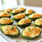 To make tasty Air Fryer Jalapeño Popper Bites, you need simple ingredients. Here’s the list: - 10 fresh jalapeños, halved and seeded - 1 cup cream cheese, softened - 1 cup shredded cheddar cheese - 1/2 cup breadcrumbs (panko for extra crunch) - 1 teaspoon garlic powder - 1 teaspoon onion powder - 1/2 teaspoon smoked paprika - Salt and pepper to taste - 1 tablespoon fresh chives, chopped (for garnish) Each ingredient plays a key role in flavor. The jalapeños give heat, while cream cheese adds creaminess. Shredded cheddar adds a rich taste. Panko breadcrumbs make the bites crunchy. Garlic powder and onion powder enhance the overall flavor. Smoked paprika adds a touch of smokiness, giving depth to each bite. Don’t forget salt and pepper, as they bring all the flavors together. Finally, fresh chives add a pop of color and fresh taste. Gather these items before you start. It makes cooking smoother and more fun! I start by preheating the air fryer to 350°F (175°C). This step is key for even cooking. It helps the poppers crisp up nicely. Just a few minutes of preheating makes a big difference. Next, I mix the fun part: the cheese mixture. In a bowl, I combine 1 cup of softened cream cheese with 1 cup of shredded cheddar cheese. Then, I add 1 teaspoon each of garlic powder and onion powder. I also sprinkle in 1/2 teaspoon of smoked paprika. A little salt and pepper goes in too. I mix everything until it’s smooth and creamy. Now, I take my fresh jalapeños and cut them in half. I remove the seeds for less heat. Each half gets a generous spoonful of the cheese mixture. I press it in gently to make sure it stays. Filling them well is important for a tasty bite. For the next step, I grab a shallow dish and pour in 1/2 cup of panko breadcrumbs. I dip the top of each stuffed jalapeño half into the breadcrumbs. This adds a nice crunch when they cook. I make sure the cheese mixture is well coated. I place the coated jalapeño poppers in the air fryer basket. I arrange them in a single layer, making sure they don’t touch. I set the timer for about 10-12 minutes. I keep an eye on them until they are tender and golden brown on top. Once they are done, I carefully take them out of the air fryer. I let them cool for a few minutes. Just before serving, I sprinkle fresh chives on top for a pop of color and flavor. These poppers look great and taste even better! Choose fresh jalapeños that feel firm and look bright. Look for ones without dark spots. A good jalapeño should have a nice shine. If you want more heat, pick smaller peppers. If you prefer milder flavors, choose larger, fatter ones. Always taste a small piece to check the heat level before cooking. You can prepare jalapeño popper bites ahead of time. Fill and coat the jalapeños, then place them on a baking sheet. Freeze them until solid, then transfer to a bag. They will last up to three months in the freezer. When ready to cook, air fry them straight from the freezer. Just add an extra couple of minutes to the cooking time. To ensure your poppers are crispy, use panko breadcrumbs. They give a great crunch. Make sure to coat the tops well by pressing them into the crumbs. Arrange the jalapeños in a single layer in the air fryer. Avoid overcrowding. This allows hot air to circulate and crisp them up perfectly. Air fry until golden brown, and enjoy every bite! {{image_2}} You can add hot sauce to the cheese mix for more heat. I like to use about one tablespoon of your favorite hot sauce. This makes the poppers extra spicy and fun! Just mix the hot sauce with your cream cheese and cheddar. Adjust the amount to fit your taste. While cheddar is classic, other cheeses work well too. Try using pepper jack for a kick or mozzarella for a milder taste. Mix different cheeses to find your favorite combo. Each cheese brings its own flavor and texture. It’s a fun way to customize your poppers! If you want a lighter option, use Greek yogurt instead of cream cheese. It gives a nice tang and cuts some fat. You can also try a dairy-free cream cheese if you want to avoid dairy. These options still give you a creamy filling without losing taste. Once you make these air fryer jalapeño popper bites, you might have some leftovers. Store any uneaten poppers in an airtight container. Keep them in the fridge, where they will last for up to three days. Make sure they cool down completely before sealing the container. This helps keep them fresh and tasty. To reheat the jalapeño poppers, preheat your air fryer to 350°F (175°C). Place the poppers in the basket in a single layer. Reheat them for about 5 to 7 minutes. This method helps restore their crunchiness. You can also use a microwave, but they may turn soft. If you use a microwave, heat them in short bursts of 30 seconds until warm. If you want to save some poppers for later, freezing is a great option. Before frying, flash-freeze the filled jalapeños on a baking sheet. Once frozen, transfer them to a freezer bag. They can last up to three months in the freezer. When you’re ready to eat them, cook straight from frozen. Just add a few extra minutes to the cooking time in the air fryer. Yes, you can use frozen jalapeños. Just make sure to thaw them first. Frozen jalapeños might be a bit softer than fresh ones. But they still work well for poppers. You may want to adjust the cooking time slightly. Many sauces taste great with jalapeño poppers. Here are a few ideas: - Ranch dressing - Creamy chipotle sauce - Sour cream with lime - Spicy salsa These sauces add extra flavor and fun to your snack. To make dairy-free jalapeño poppers, swap out the cream cheese and cheddar. Use vegan cream cheese and dairy-free cheese instead. Check the labels to ensure they fit your needs. You can also add nutritional yeast for a cheesy flavor. Yes, you can bake jalapeño poppers in the oven. Preheat the oven to 375°F (190°C). Place the stuffed jalapeños on a baking sheet. Bake for about 20-25 minutes. Look for a golden brown top and tender jalapeños. Enjoy your tasty snack! In this post, we explored how to make delicious jalapeño poppers. We covered ingredients, preparation steps, and smart tips to enhance your dish. You learned about spicy variations and how to store leftovers. These poppers can be enjoyed fresh or frozen for later. Try these recipes and make them your own. Enjoy the fun of cooking and sharing!