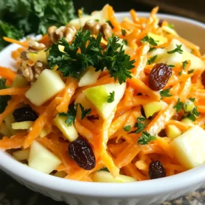 - 2 large carrots, peeled and grated - 1 large tart apple (like Granny Smith), cored and grated - 1/4 cup raisins - 1/4 cup chopped walnuts (or pecans) The main ingredients of this slaw give it a fresh and crunchy feel. Grated carrots offer a sweet, earthy taste. The tart apple, like Granny Smith, adds a nice tang. Raisins bring a chewy sweetness, while walnuts give a satisfying crunch. - 1/4 cup plain Greek yogurt - 2 tablespoons honey - 1 tablespoon apple cider vinegar - 1 teaspoon Dijon mustard The dressing is creamy and zesty. Greek yogurt adds richness without being too heavy. Honey sweetens it up, while apple cider vinegar gives a sharp bite. Dijon mustard rounds it out with a nice kick. - Salt and pepper to taste - Fresh parsley, chopped for garnish Salt and pepper enhance the flavors. Fresh parsley not only adds a pop of color but also brightens the dish. It makes the slaw look as good as it tastes. This carrot apple slaw is not just a salad; it’s a blend of flavors and textures. Perfect for a side dish or a light meal, it’s both tasty and fun to make! {{ingredient_image_1}} 1. First, take 2 large carrots, peel them, and grate them into a big bowl. 2. Next, grab 1 large tart apple, core it, and grate it. Add this to the bowl with carrots. 3. Then, mix in 1/4 cup of raisins. This adds a nice sweetness. 4. Finally, add 1/4 cup of chopped walnuts. They give a great crunch. 1. In a small bowl, measure out 1/4 cup of plain Greek yogurt. 2. Add 2 tablespoons of honey to the yogurt for sweetness. 3. Pour in 1 tablespoon of apple cider vinegar for tang. 4. Lastly, add 1 teaspoon of Dijon mustard. 5. Whisk all these together until the mixture is smooth and creamy. 1. Now, pour the dressing over the carrot and apple mixture. 2. Toss everything well to coat all the ingredients in the dressing. 3. Season with salt and pepper to taste, adjusting to your liking. 4. Cover the slaw and chill it in the refrigerator for at least 30 minutes. 5. Just before serving, give the slaw another toss. 6. Garnish with chopped fresh parsley for a splash of color. - You can swap Greek yogurt for a dairy-free option like coconut yogurt. - If you have nut allergies, use seeds or skip the nuts entirely. - Add fresh herbs like mint or cilantro for a pop of flavor. - Adjust the sweetness by adding more or less honey to suit your taste. - Serve your slaw in bright, colorful bowls to catch the eye. - Sprinkle extra parsley on top for a fresh, green touch. These small changes can make your carrot apple slaw even more enjoyable. Have fun experimenting! Pro Tips Fresh Ingredients: Use the freshest carrots and apples you can find for the best flavor and texture. Chill Time: Allow the slaw to chill in the refrigerator for at least 30 minutes to let the flavors meld beautifully. Nut Options: Feel free to substitute walnuts with pecans or even sunflower seeds for a nut-free version. Serving Suggestion: This slaw pairs wonderfully with grilled meats or as a light lunch on its own. {{image_2}} You can switch up the fruits for great taste. Add oranges for a burst of sweetness. Pineapple also brings a nice tropical flavor. Try using a sweet apple like Fuji or Honeycrisp instead of a tart apple. This swap makes the slaw sweeter and more appealing. To make the slaw even more exciting, think about adding texture. Shredded cabbage adds crunch and a different flavor. Bell peppers also work well; they give a nice color and crisp bite. For an extra crunch, top the slaw with sunflower seeds. They add a nutty flavor and more nutrients. If you want a vegan option, swap out Greek yogurt for plant-based yogurt. This keeps the creaminess while making it dairy-free. For a low-carb version, use non-sugary sweeteners like stevia or erythritol. This keeps the sweetness without the extra carbs. To keep your carrot apple slaw fresh, store it in an airtight container. This helps maintain its crunch and flavor. Place the container in the refrigerator right after you make it. For the best taste, eat the slaw within 2-3 days. After that, the texture may start to change. It’s best to enjoy it while it’s still bright and crisp. Freezing carrot apple slaw is not a good idea. The texture will change when thawed. This slaw is best enjoyed fresh and crunchy. Carrot apple slaw is packed with vitamins and minerals. Carrots provide vitamin A, which is great for your eyes and skin. They also contain fiber, which helps digestion. Apples add vitamin C, boosting your immune system. They have antioxidants that help fight disease. The walnuts in the slaw give healthy fats and protein. Greek yogurt adds calcium and probiotics for gut health. Overall, this slaw is a tasty way to get nutrients. Yes, you can make carrot apple slaw ahead of time. It stays fresh in the fridge for 2-3 days. However, mix the dressing just before serving. If you add the dressing early, the slaw may get soggy. By waiting, you keep the crunch and flavor bright. This way, you can enjoy a fresh taste each time. Carrot apple slaw works well for meal prep. You can make a large batch for easy meals. Store it in an airtight container in the fridge. This slaw is a great side dish or snack. You can serve it with sandwiches or grilled meats. Just remember to keep the dressing separate until you are ready to eat. This will help keep your slaw fresh and crunchy. Carrot apple slaw is a simple and tasty dish. We combined crunchy carrots, tart apples, and nuts with a creamy dressing. You can customize it with different fruits, nuts, or dairy-free options. Store it in the fridge to enjoy fresh for a few days. This slaw is perfect for quick meals or gatherings. Try making it your own by adding your favorite flavors. Enjoy your healthy creation and share it with friends!
