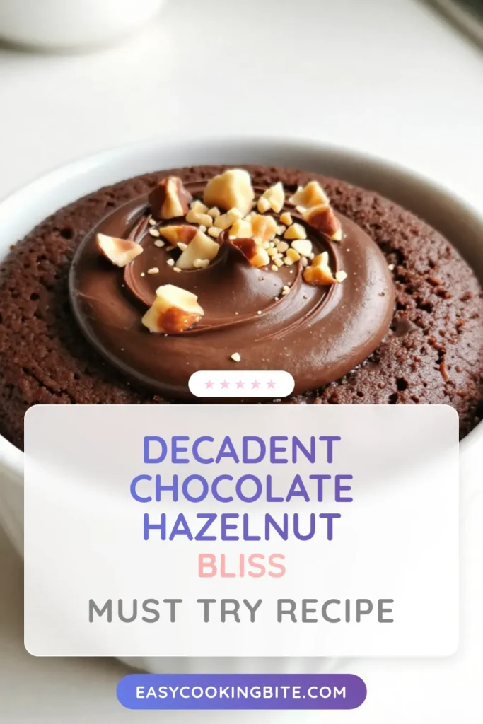 Indulge in a quick chocolate dessert with this delectable chocolate hazelnut mug cake! This easy mug cake recipe makes a rich and moist microwave chocolate cake, perfect for satisfying your sweet cravings. Ready in just 5 minutes, this single serving mug cake is an effortless treat for any chocolate lover. Try it today and enjoy a delightful melty center that will leave you wanting more! Save this recipe for later. #MugCake #ChocolateHazelnut #EasyDesserts #QuickRecipes